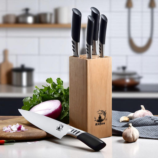 Set of knives in a wooden block on a kitchen counter with vegetables.